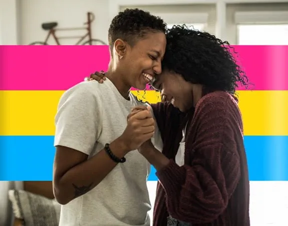 Two people embracing and smiling