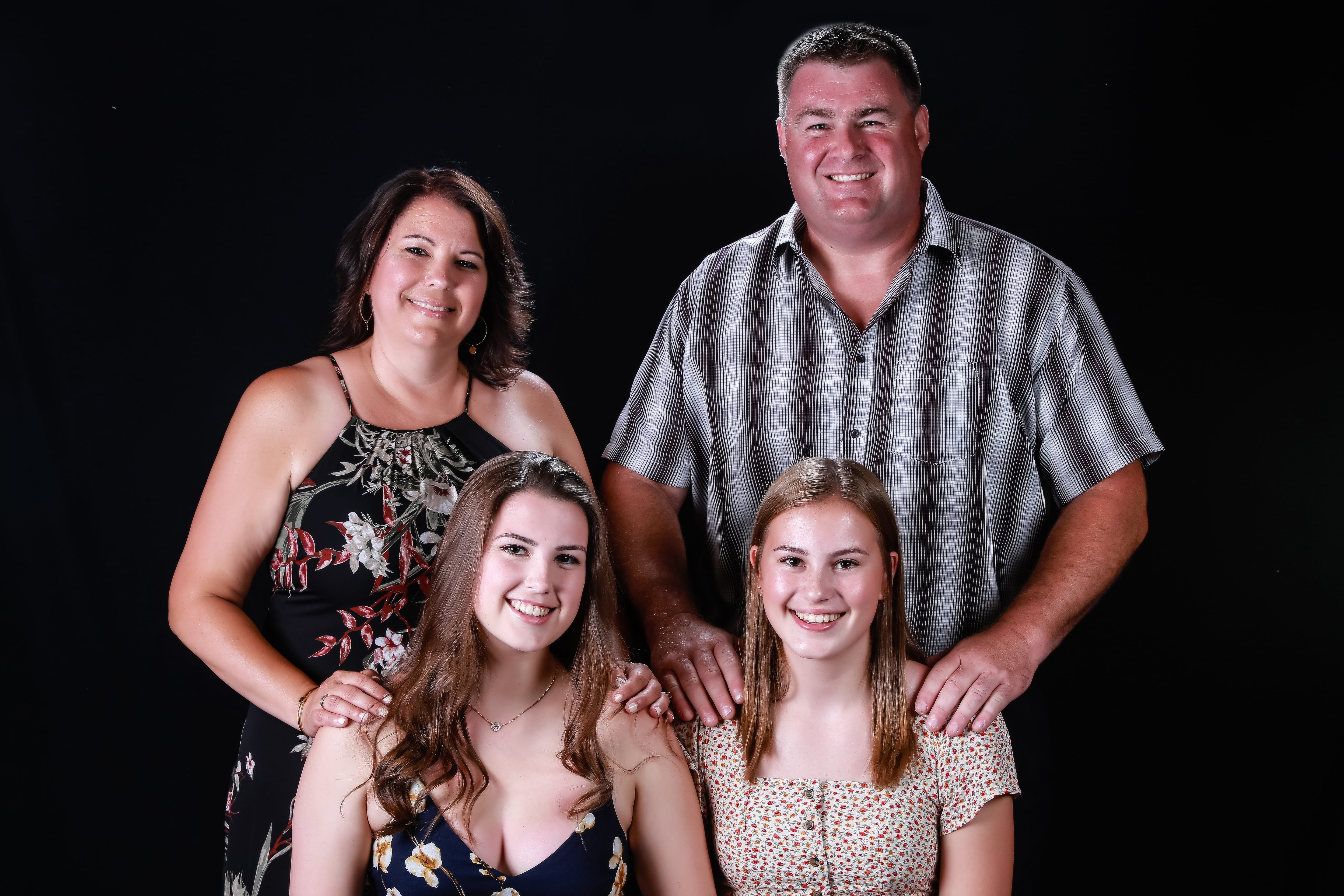 A family photo of Dianne with her husband and 2 daughters 