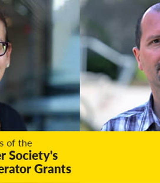 Dr Harriet Feilotter and Dr Trevor Dummer above a banner for the Canadian Cancer Society’s inaugural Accelerator Grants