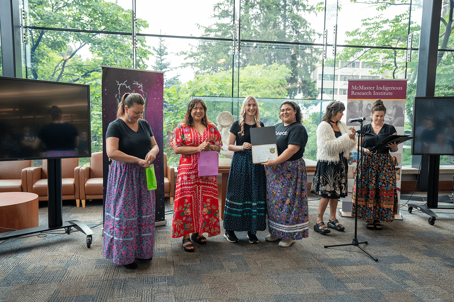 Ashley King holds up the certificate given to her by IndigiNerds program staff.