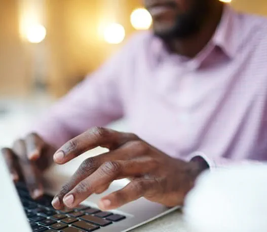 A man on a laptop doing online research