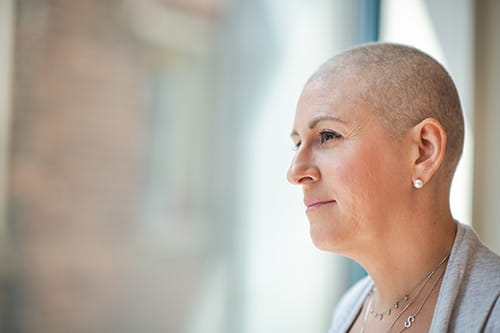 A woman with a shaved head