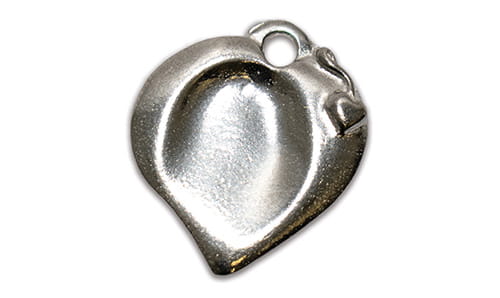 A small heart shaped pewter charm