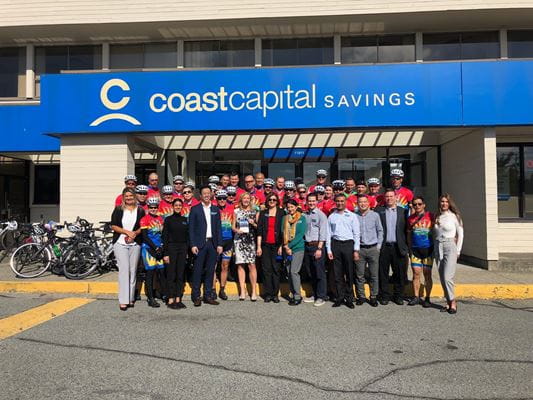 Coast Capital Savings members pose with riders from the Cops for Cancer Tour de Coast squad during this year’s Tour
