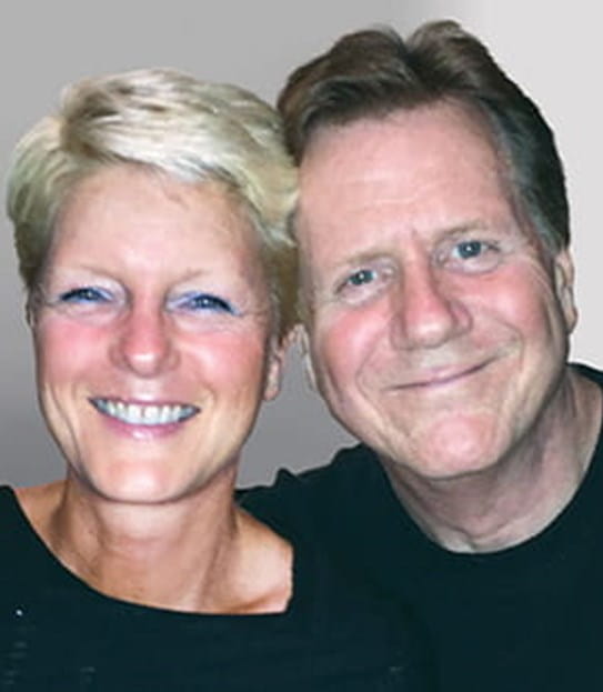 Brian smiling with his wife