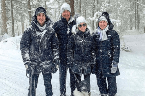 Stephanie and her family in a forest during winter.
