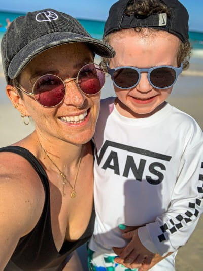 Laurie at the beach with her son.