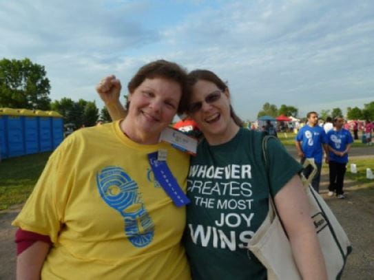 Louise and a cheering friend at a Relay For Life track.