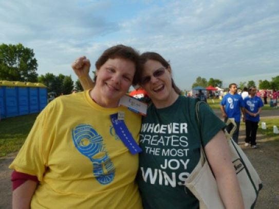 Louise and a cheering friend at a Relay For Life track.