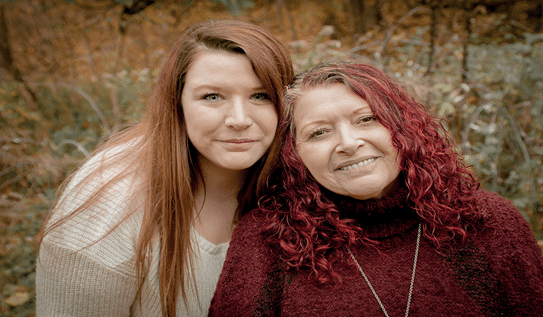 Chantel standing next to her mother Debra.