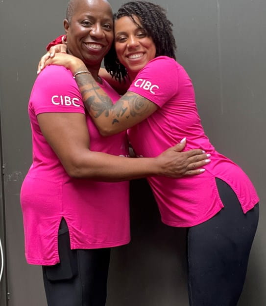 Coral and her daughter hugging and they are wearing pink CIBC Run for the Cure t-shirts