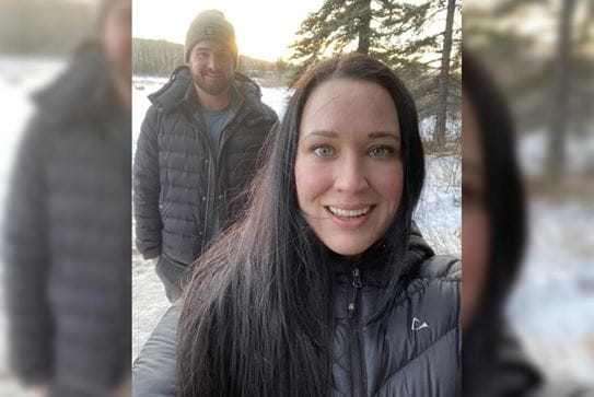 A selfie of Vanessa and her husband outside during the winter