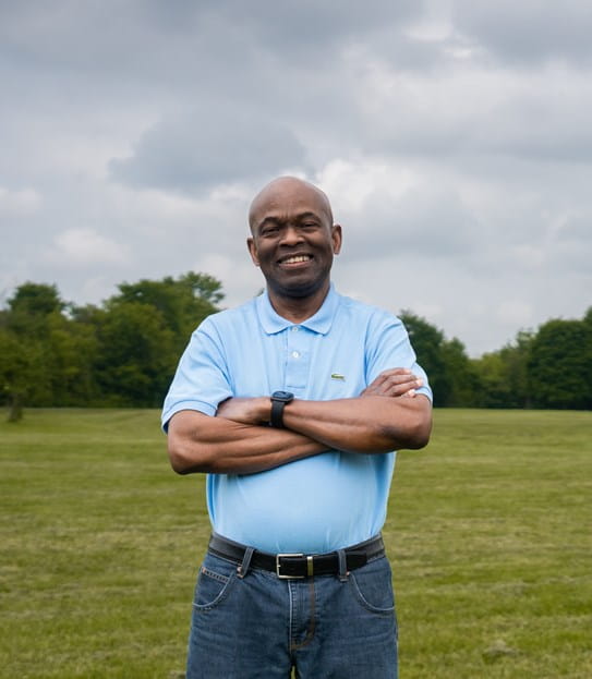 Anthony Henry standing in a field