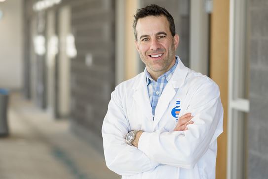Dr Gilles Robichaud, smiling at the camera.