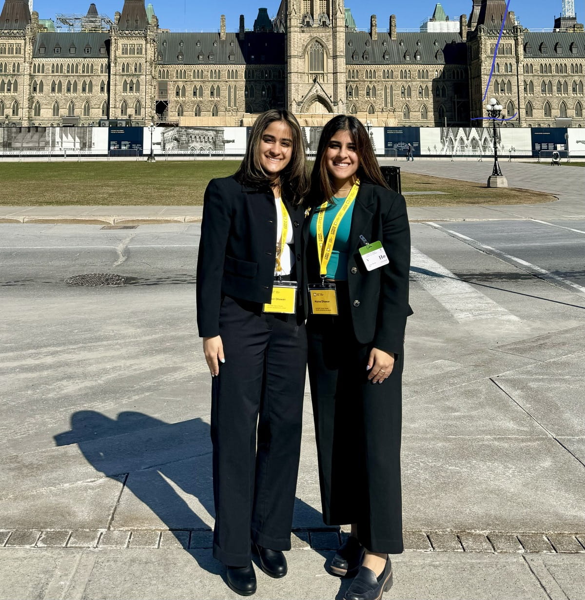 Alaina and Jillian Dhawan, standing on Parliament Hill.