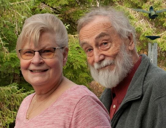 James Miller and Gladys Suderman smiling in front of trees.
