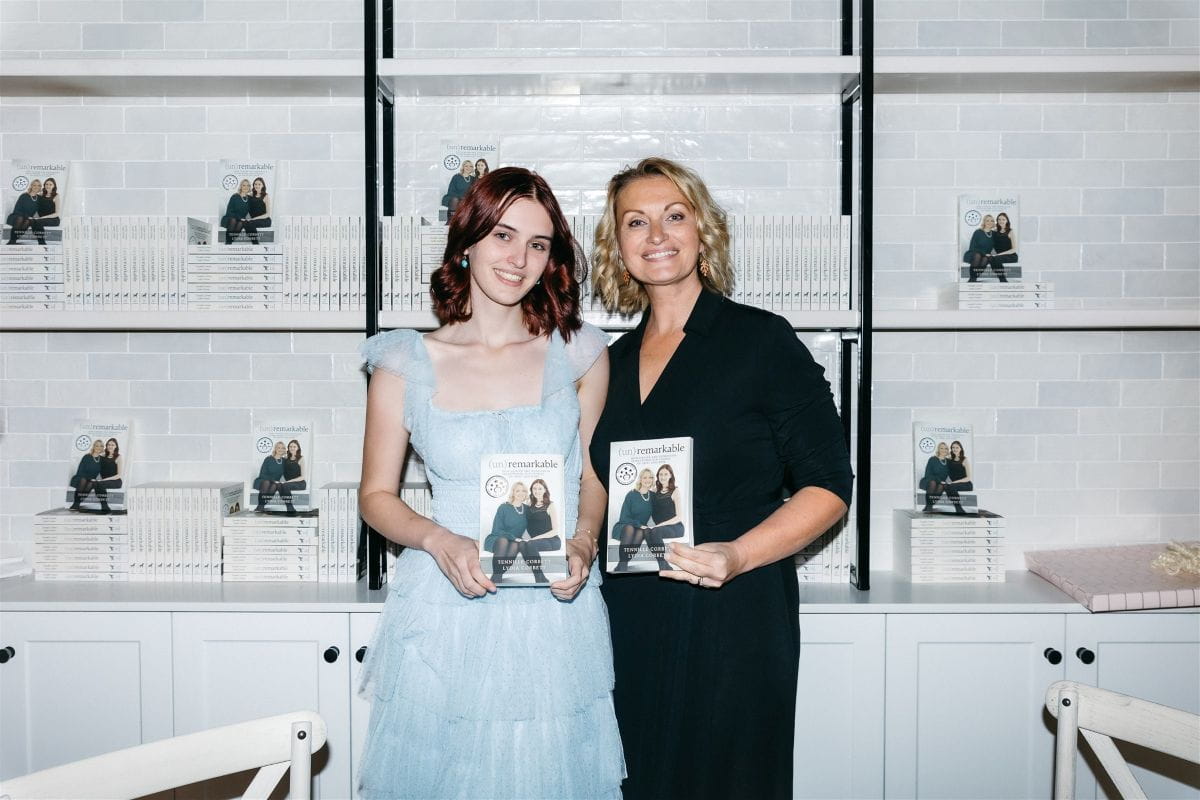 Tennille and her daughter pose with copies of their book.