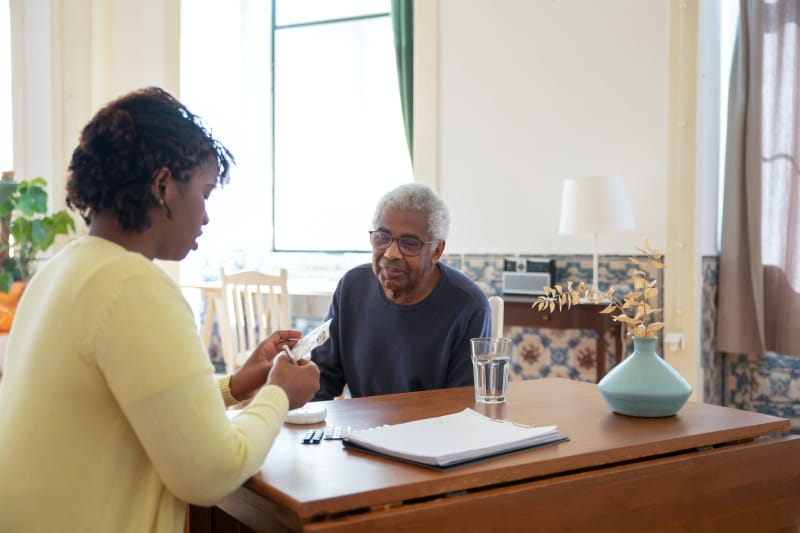 Two people sitting at a table.
