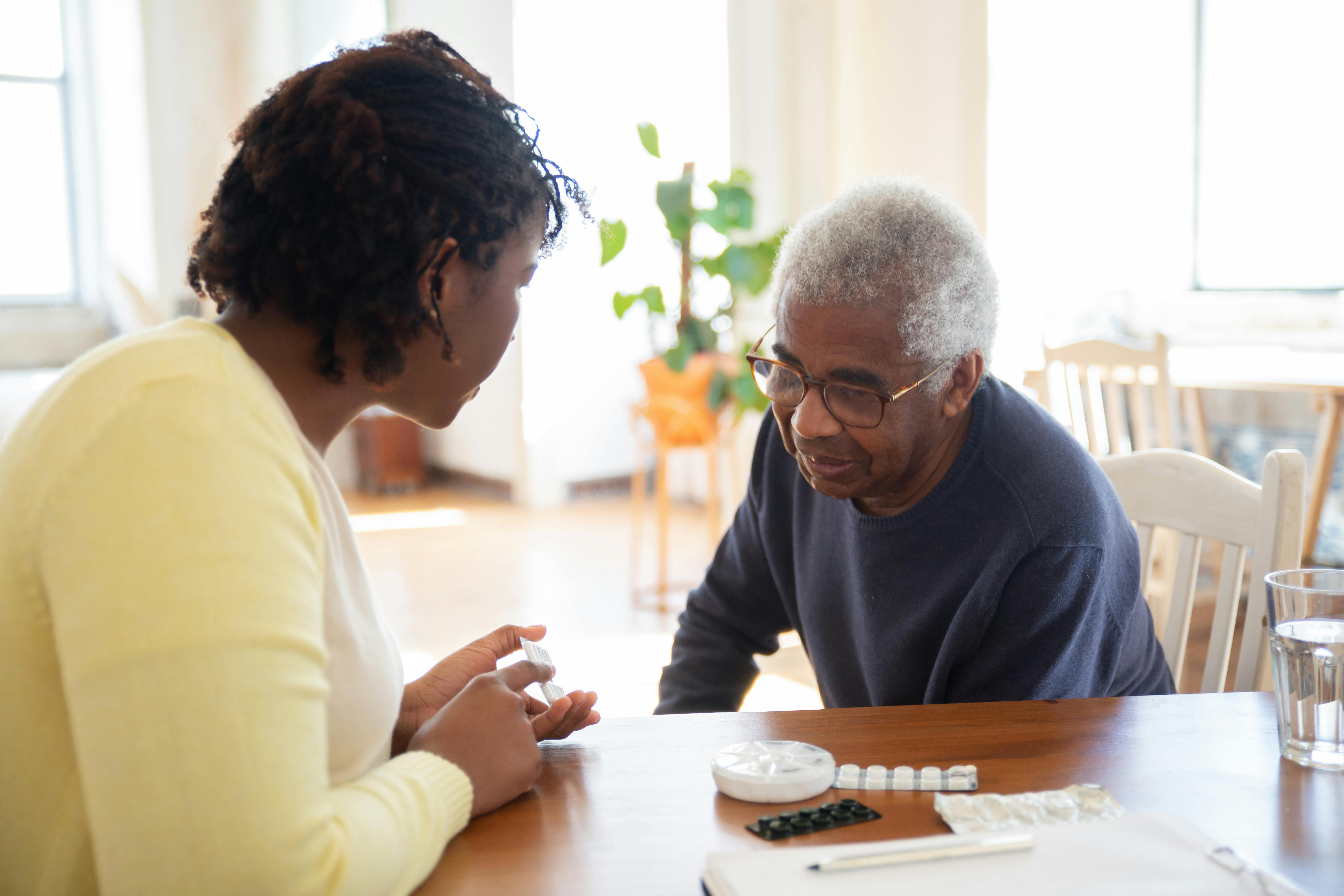 Two people sitting at a table.