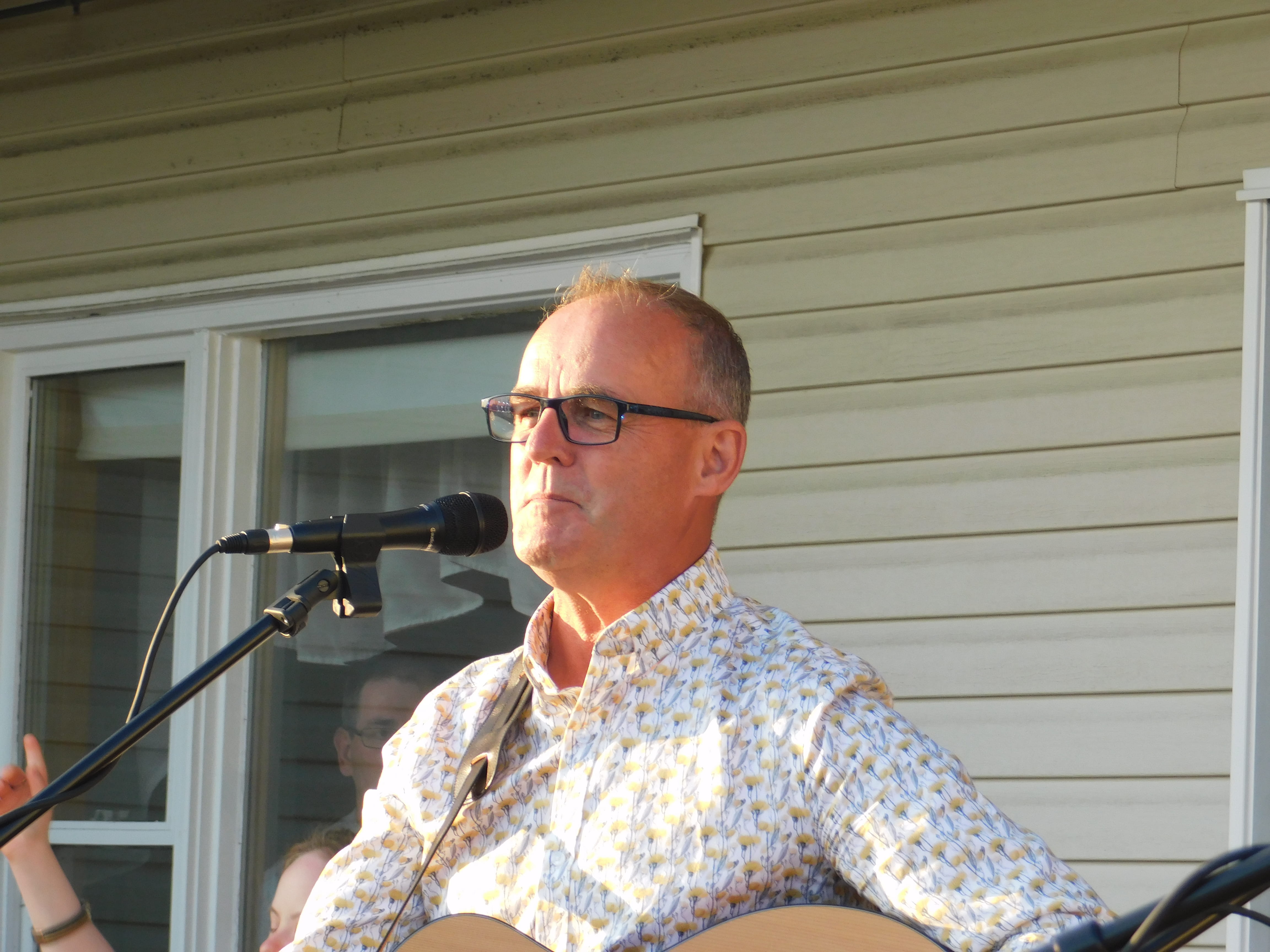 Wylie in front of a microphone