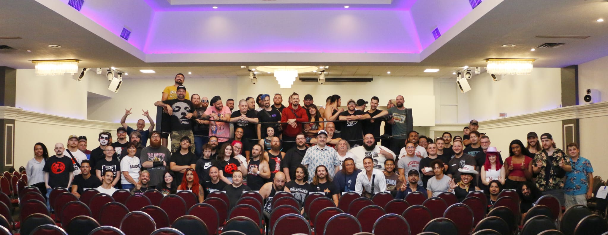 All participants and volunteers at C4 Wrestling's Fighting Back 14 in 2025 standing on the ring and in front of it.