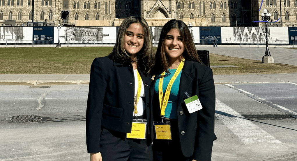 Alaina and Jillian Dhawan, standing on Parliament Hill.