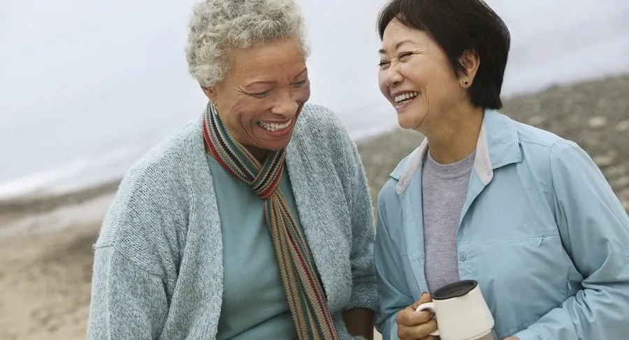 Two people going for a walk on the beach