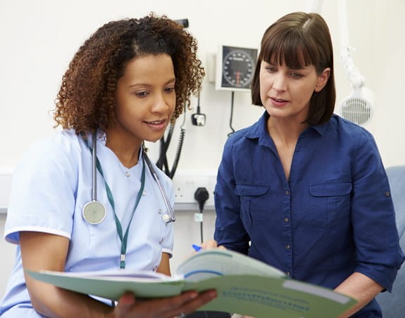 Doctor reviewing test results with a patient