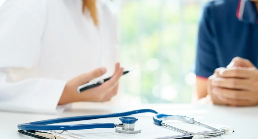 A stethoscope on top of a clipboard