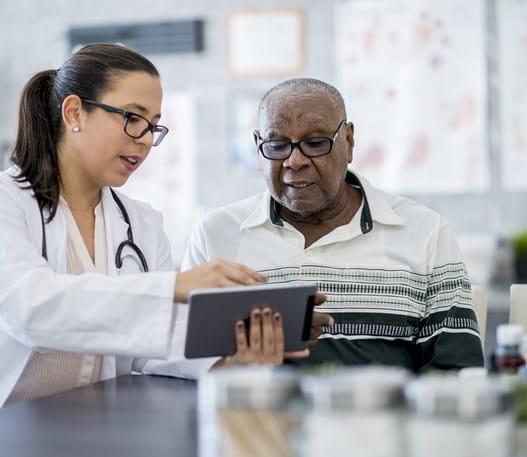 Person looking at test results with their doctor