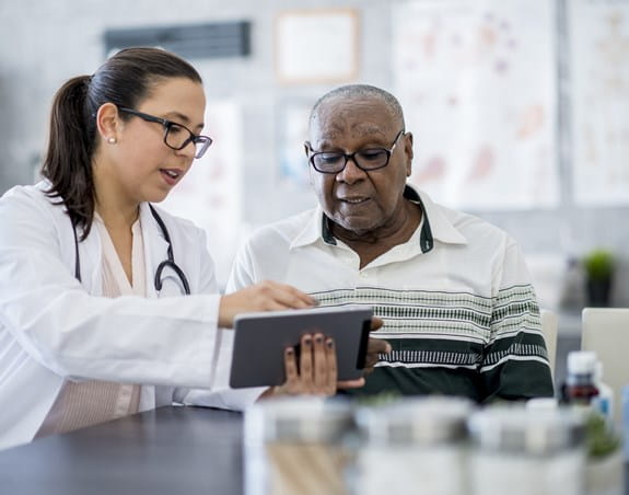 Person looking at test results with their doctor