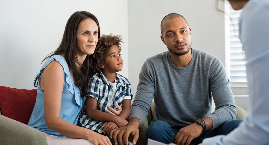 Couple talking to a family doctor.