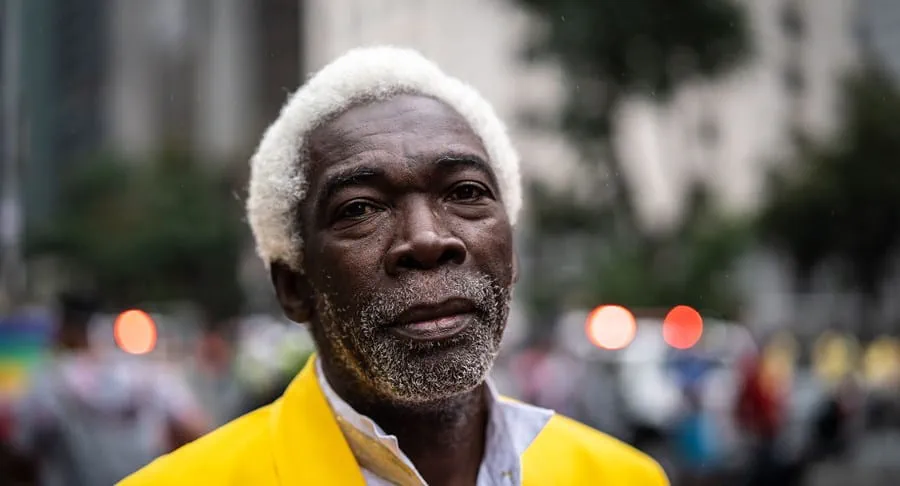 An older Black man looking at the camera.