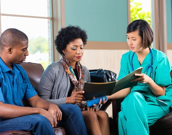 Doctor consulting with patients in a waiting room
