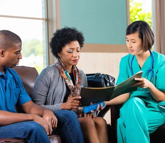 Doctor consulting with patients in a waiting room