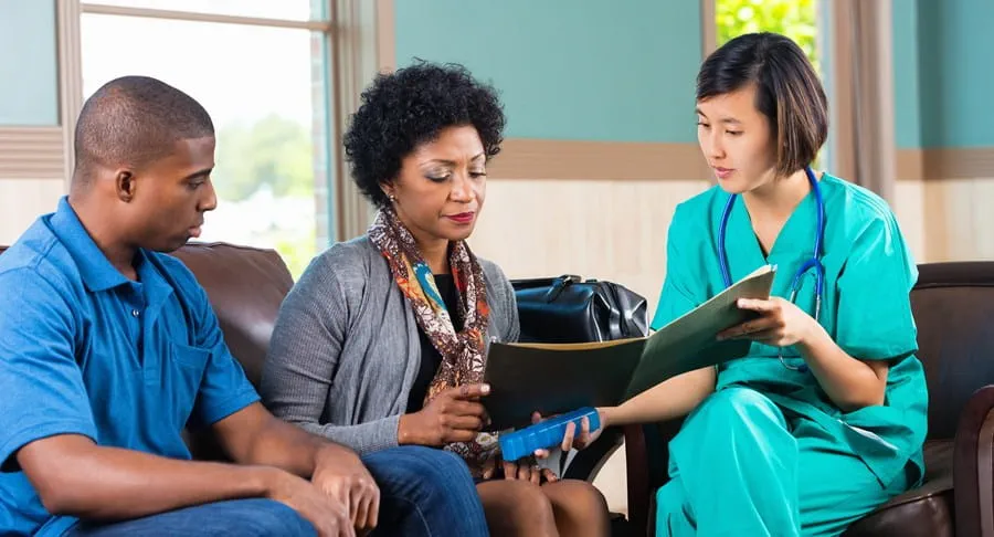 Doctor consulting with patients in a waiting room