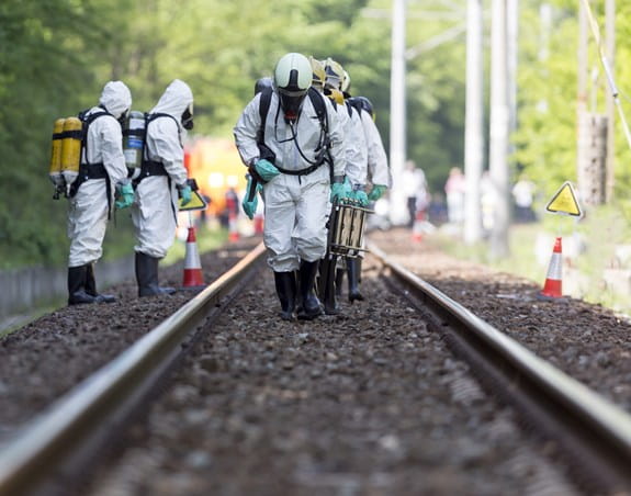 Workers wearing hazard suits