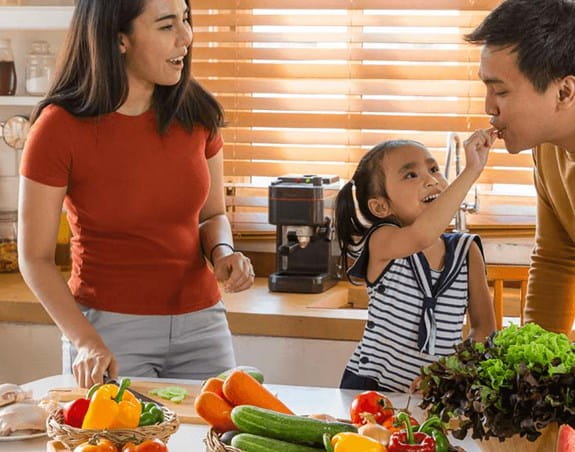 A family preparing a meal together in the kitchen