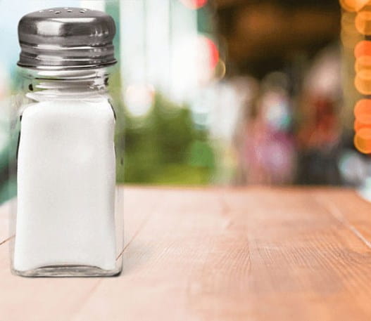 A salt shaker on a table