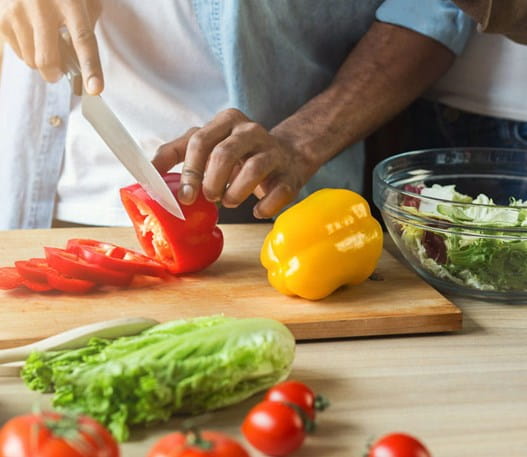 Bell peppers being chopped for a salad