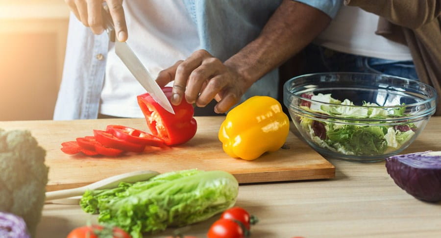 Bell peppers being chopped for a salad