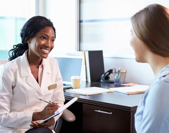 A patient talking to a doctor