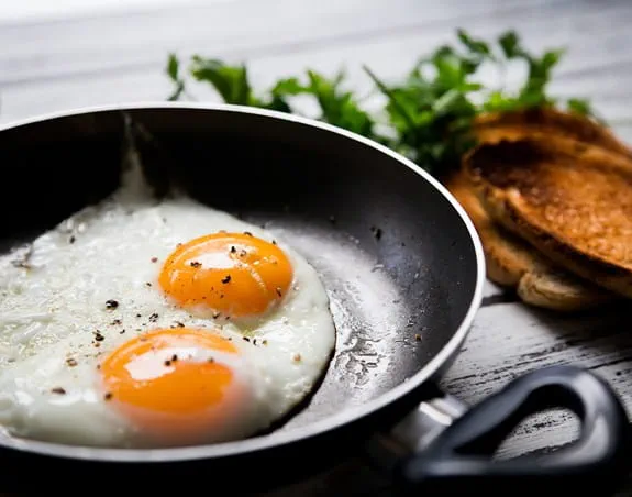 Eggs cooking in a non-stick frying pan