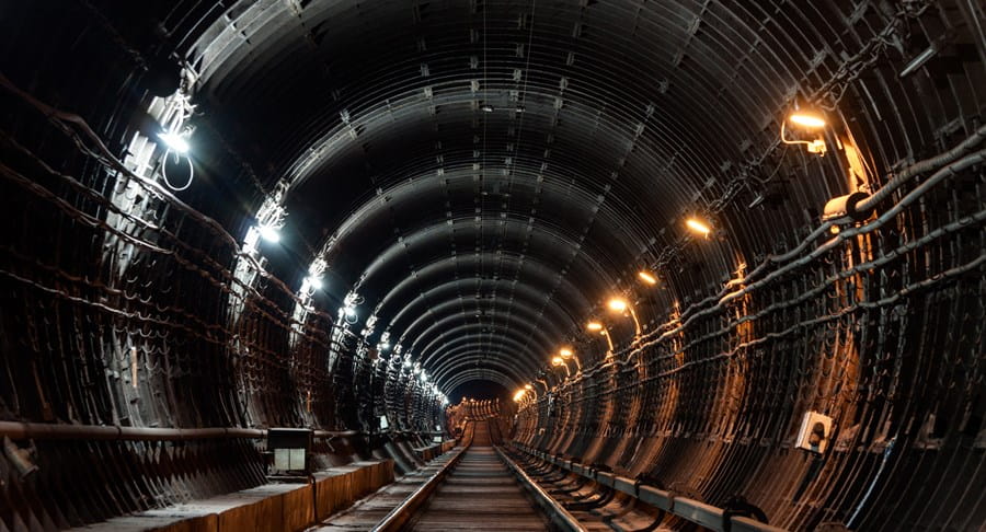 Underground subway tunnel with lights illuminating it