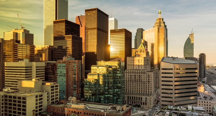 Aerial view of a city with office towers and other buildings