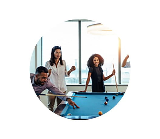 Group of people playing pool together