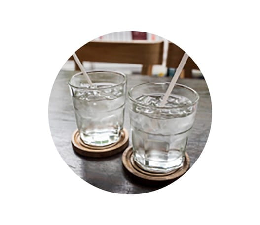 Two glasses of water on a table