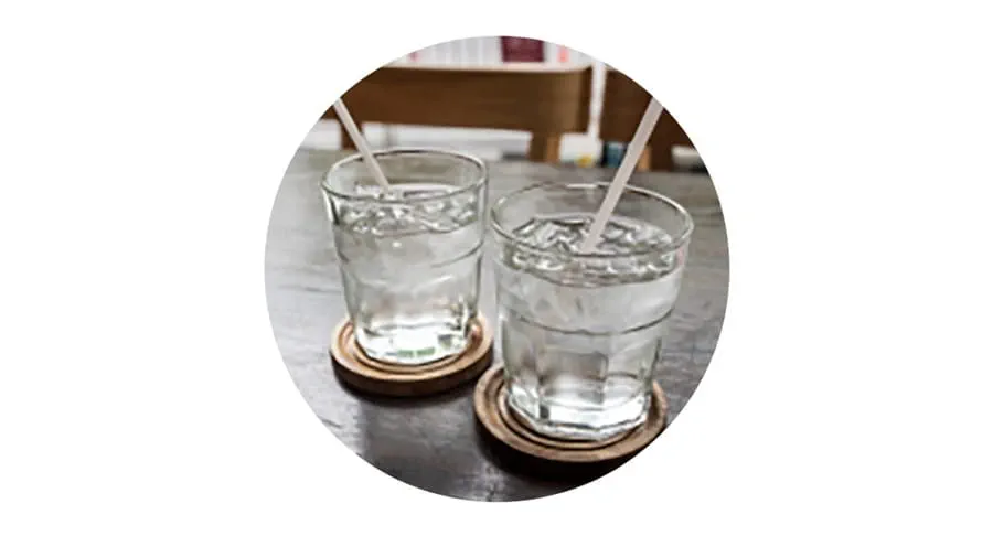 Two glasses of water on a table