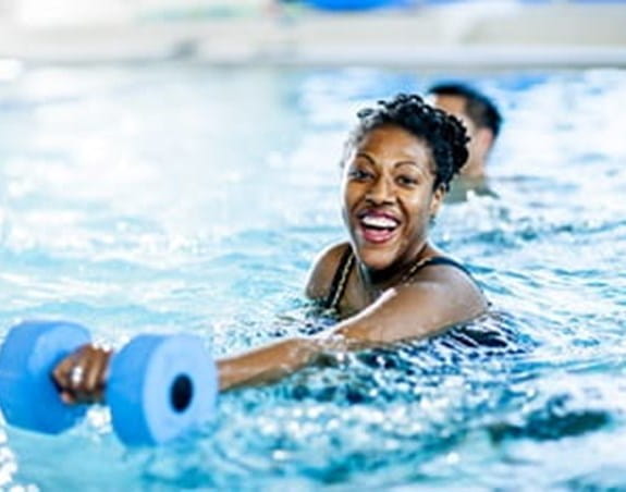 A person exercising in a swimming pool