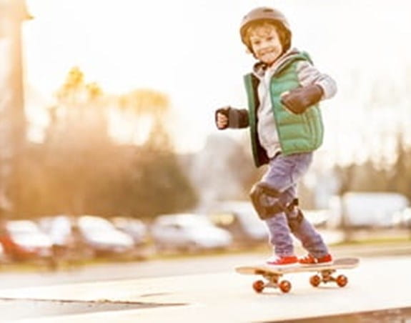 A kid on a skateboard outside